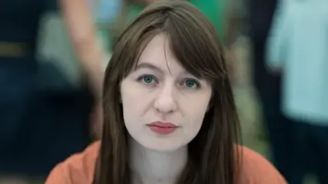 Sally Rooney claims she cannot travel to the UK due to legal concerns